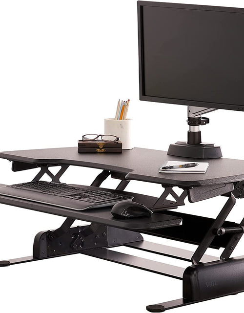 Load image into Gallery viewer, - desk Essential 36 - Two-Tier Standing Desk Converter for Monitor &amp; Accessories - Height Adjustable Sit Stand Desk - Fully Assembled Monitor Riser for Home Office - 36" Wide, Black

